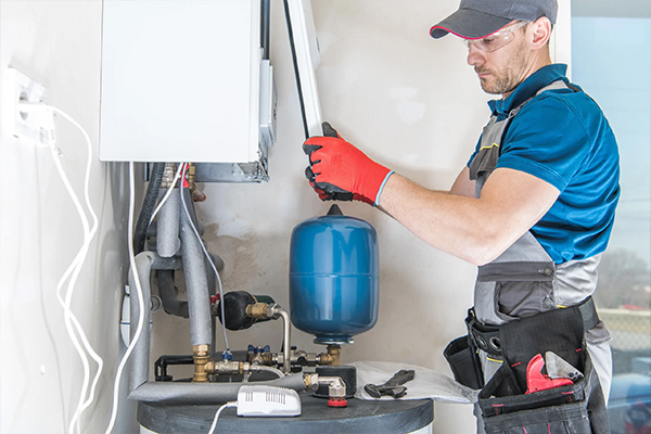 Tech working on electric furnace